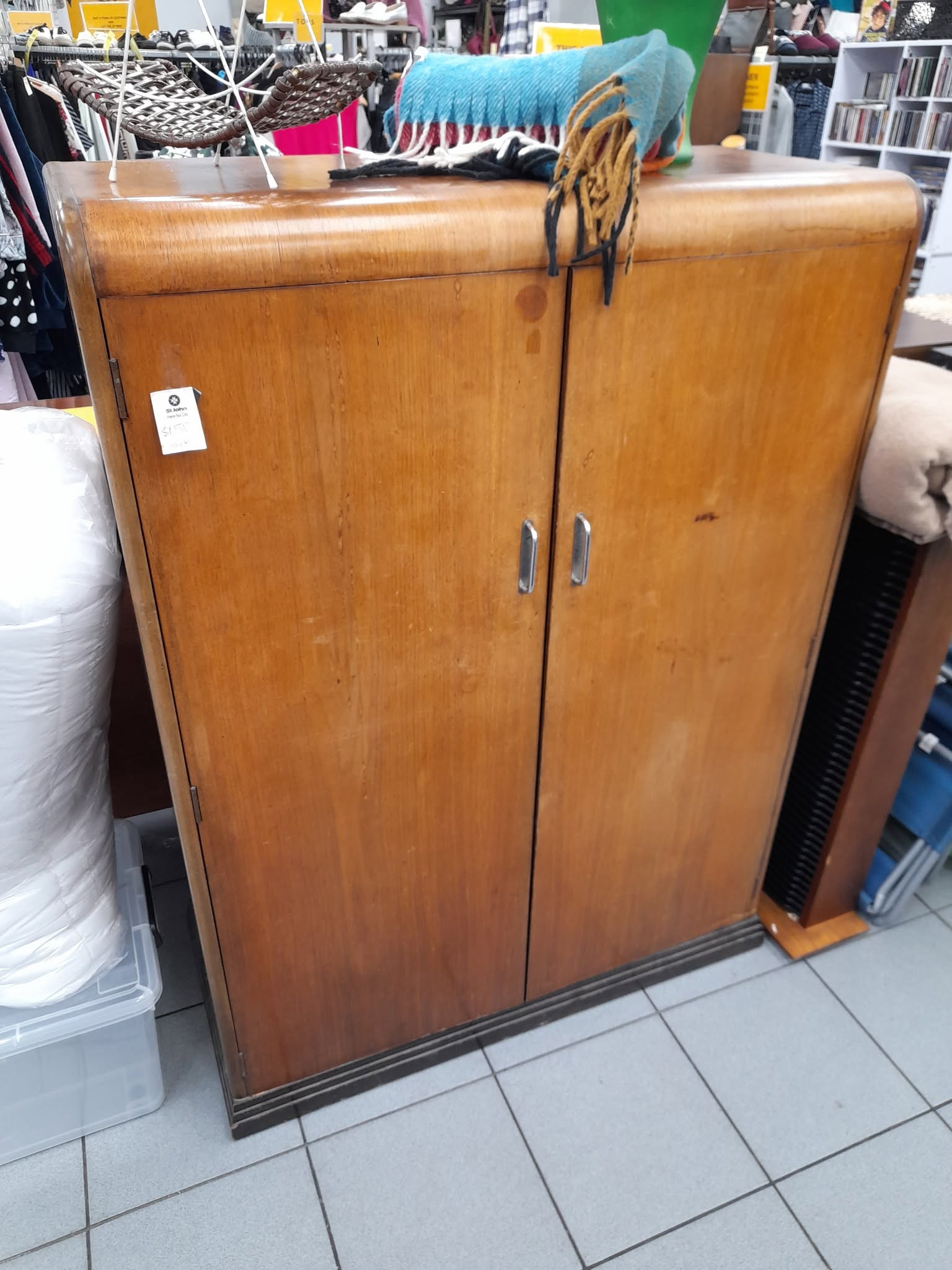 New furniture and homewares are in store at St John Ferry Road, including a rimu display cabinet priced at $275. Clothing is buy two items and get a third item of equal or lesser value free.