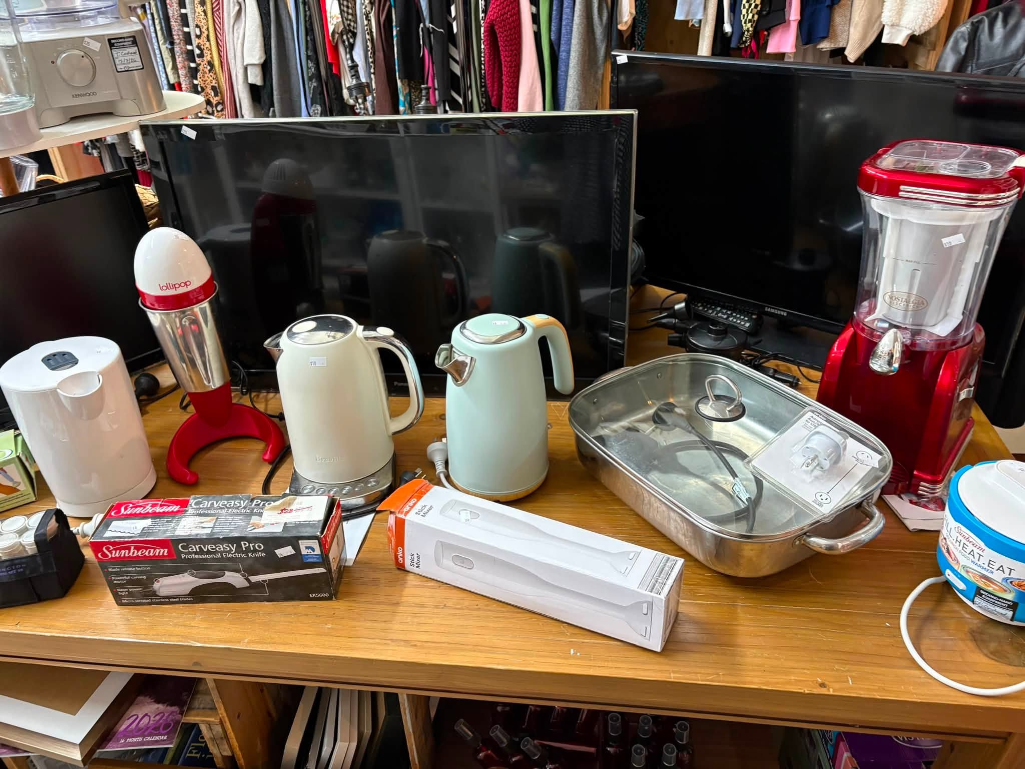 Vintage and old-tech finds are in store at Coastal Treasures, including corded telephones, toys, homewares, clothing and a Barbie Dreamhouse priced at $80.