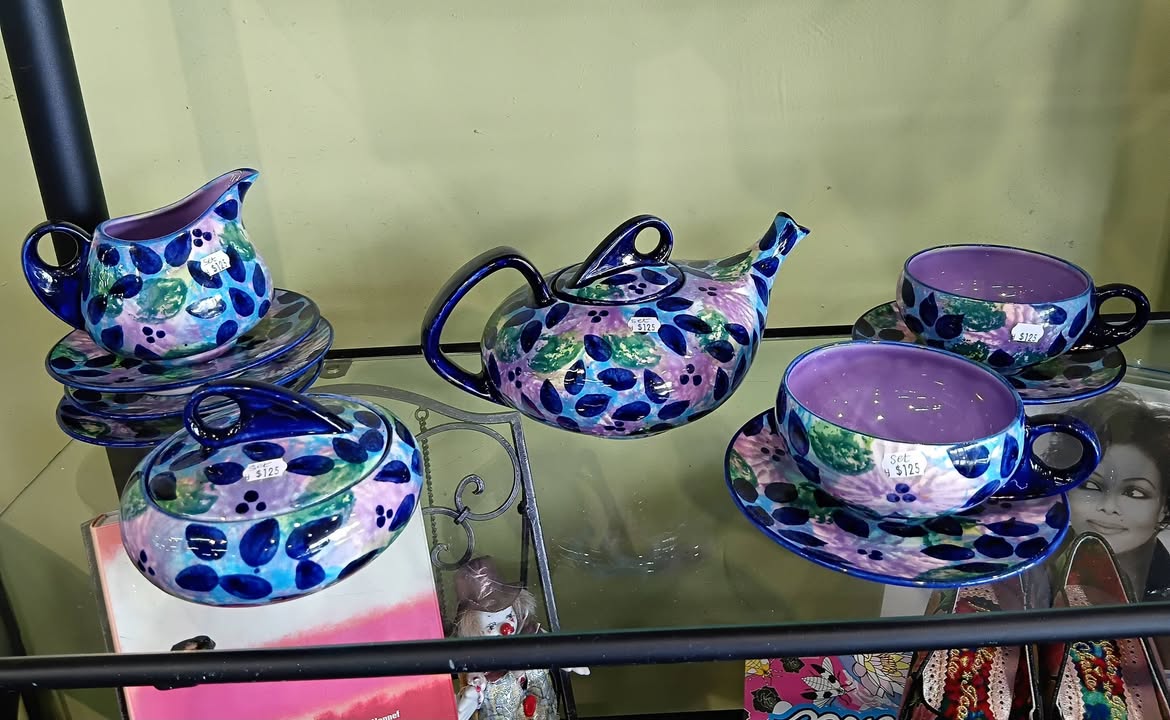 Fresh staff picks at St John Wairau Park Store include red boots, a biker jacket, floral shoes and a purple ceramic tea set.