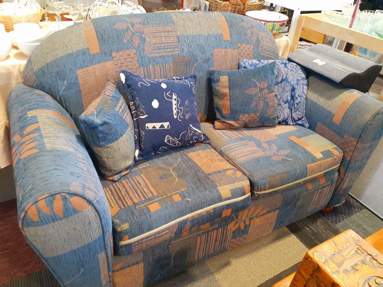 Two 2-seater sofas are $60 each and two computer chairs are $20 each at St John Waiuku Store.