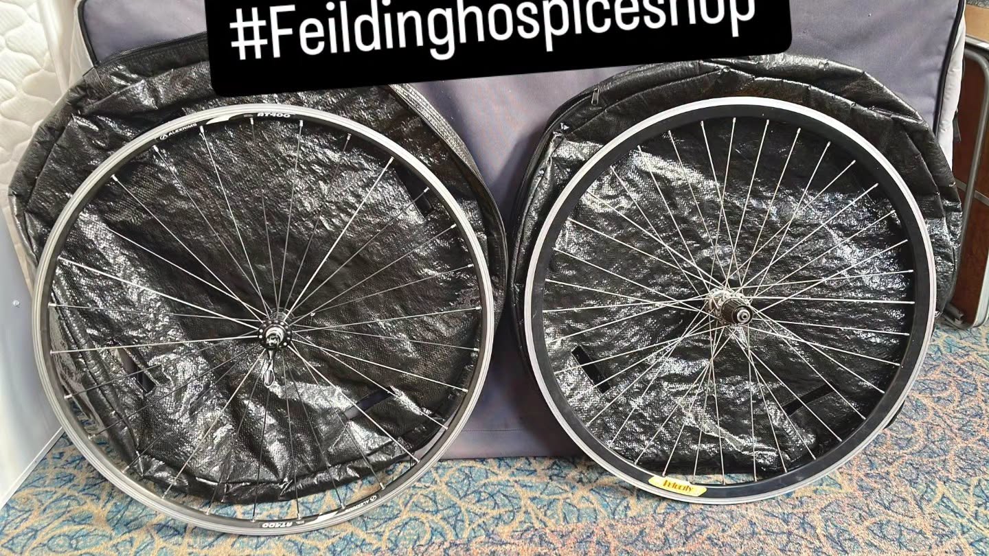 Two AlexRims bike wheels with wheel bags and a Torpedo 7 bike transporting bag are at Arohanui Hospice Shop Feilding now.