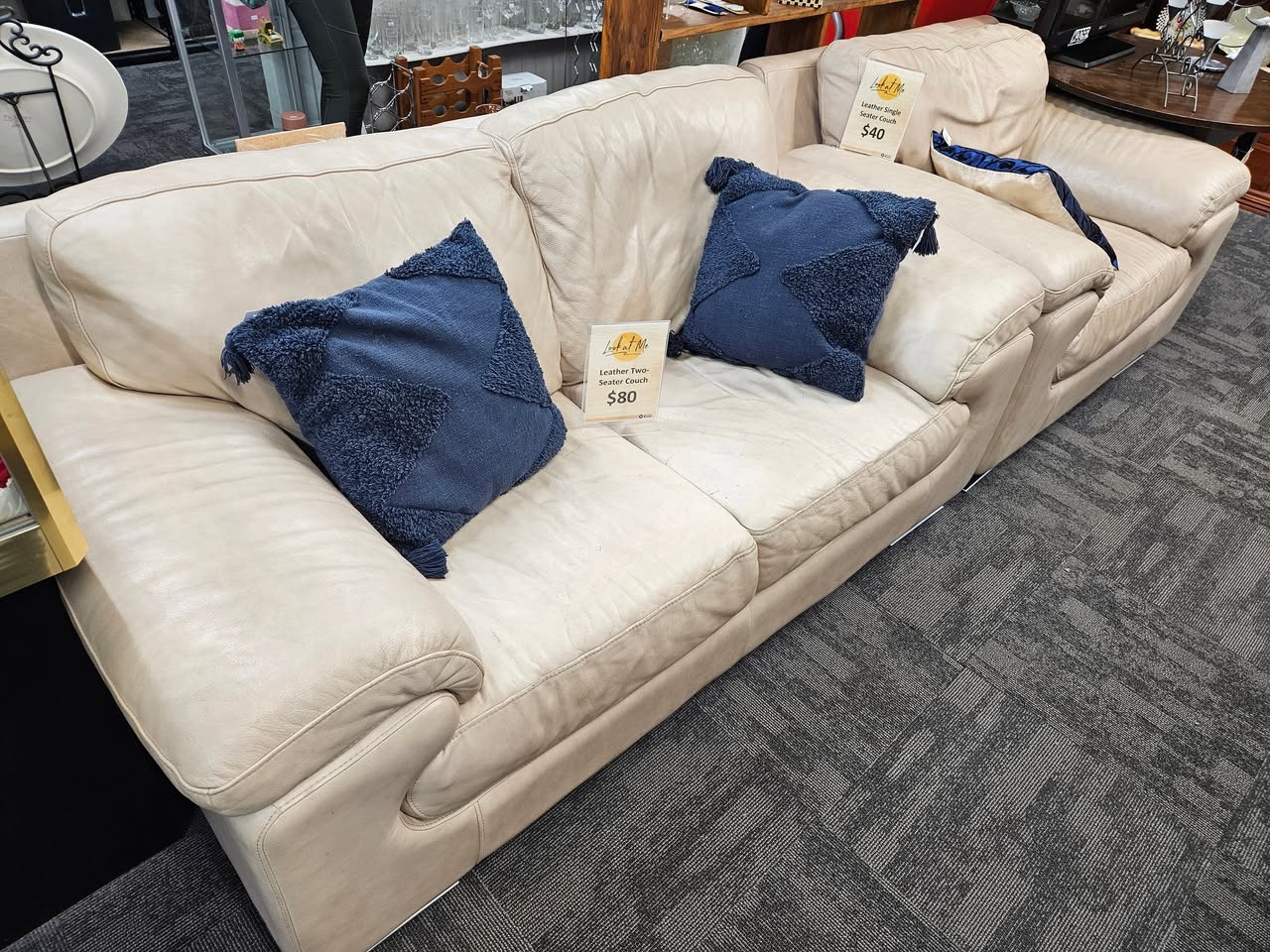 Fresh furniture and homewares are on the floor at St John Tauranga Store, including a cream leather two-seater couch for $80, a matching single-seater for $40 and a Sony Bravia television for $40.