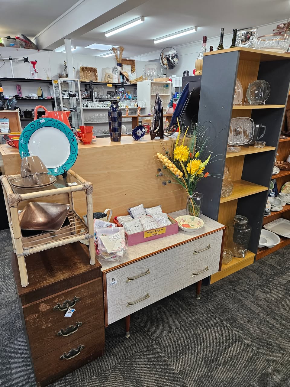 Fresh furniture and homewares are on the floor at St John Tauranga Store, including a cream leather two-seater couch for $80, a matching single-seater for $40 and a Sony Bravia television for $40.