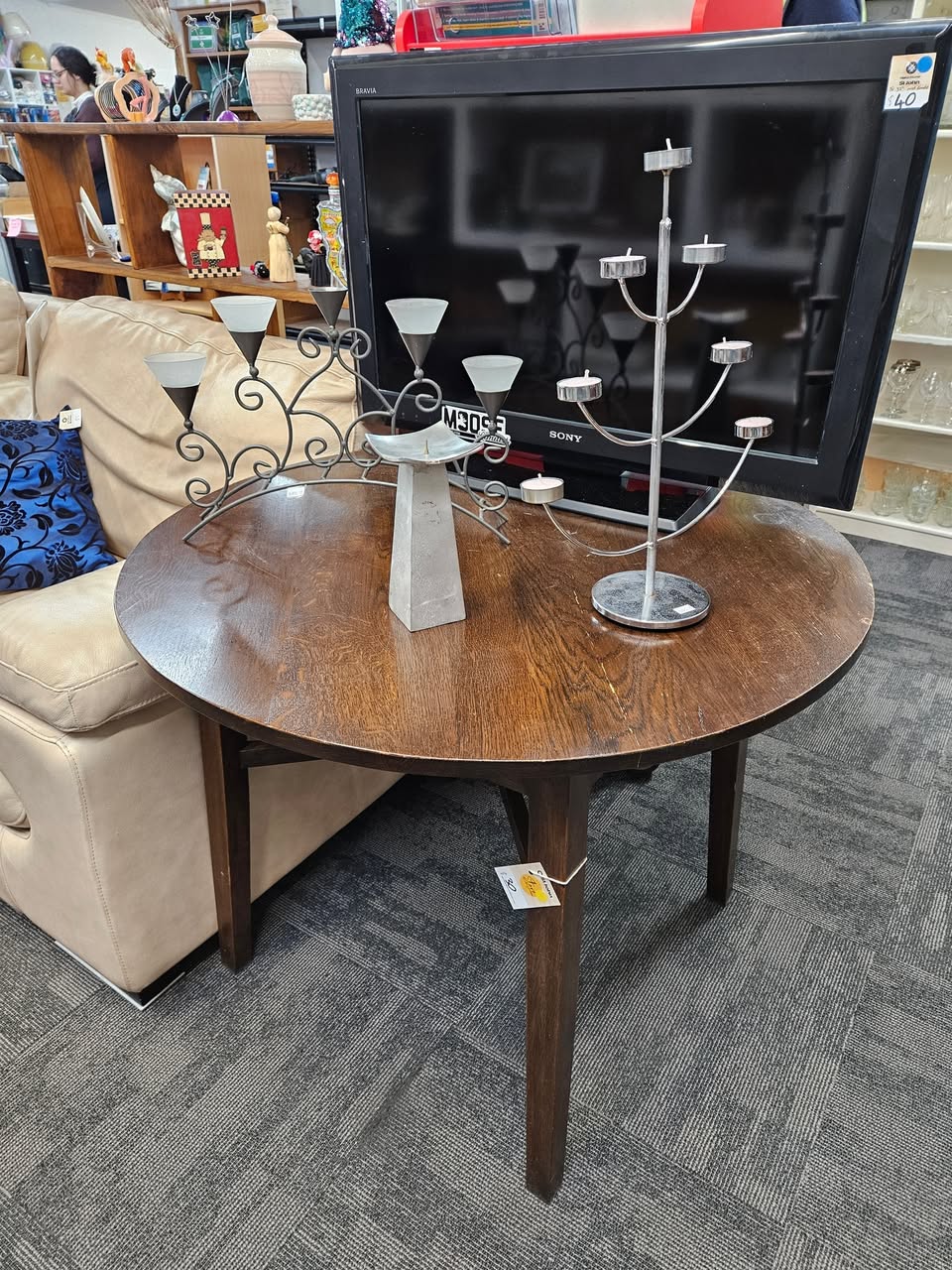 Fresh furniture and homewares are on the floor at St John Tauranga Store, including a cream leather two-seater couch for $80, a matching single-seater for $40 and a Sony Bravia television for $40.