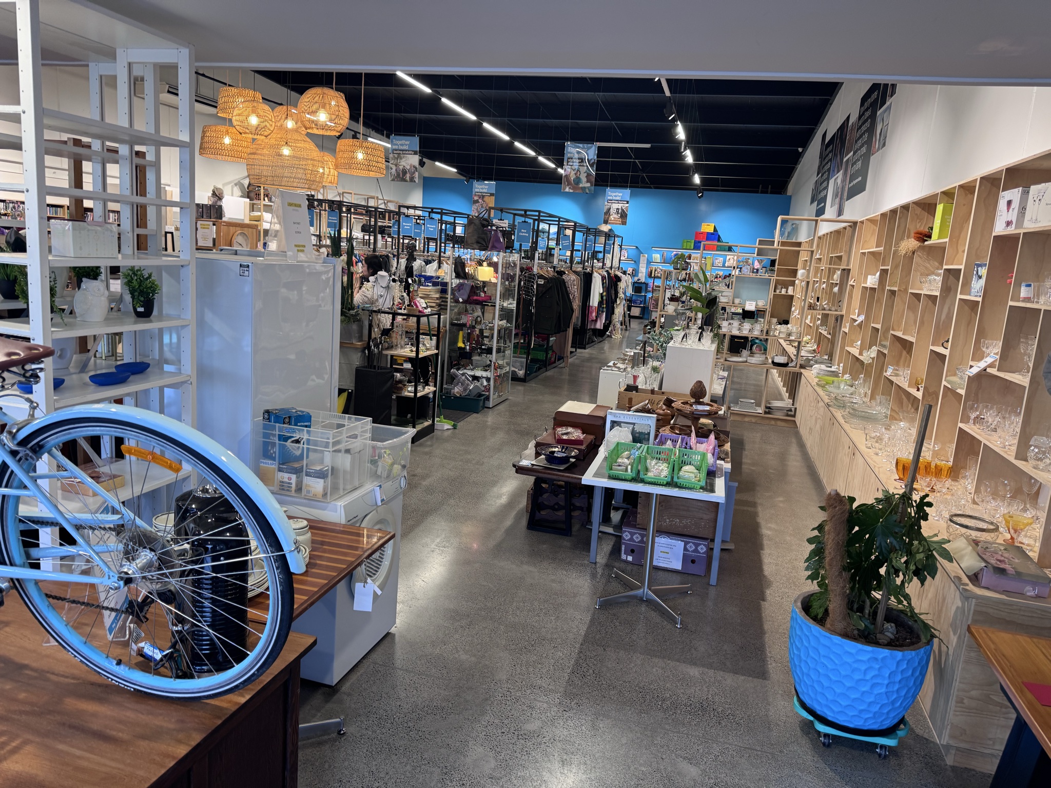 Much better location here and huge selection, especially lots of collectors items and designer furniture. Pricing seems reasonable on clothes