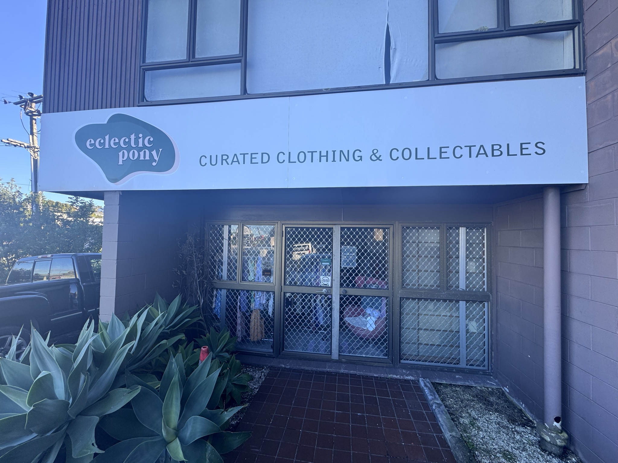 Little store with a few racks, limited hours.