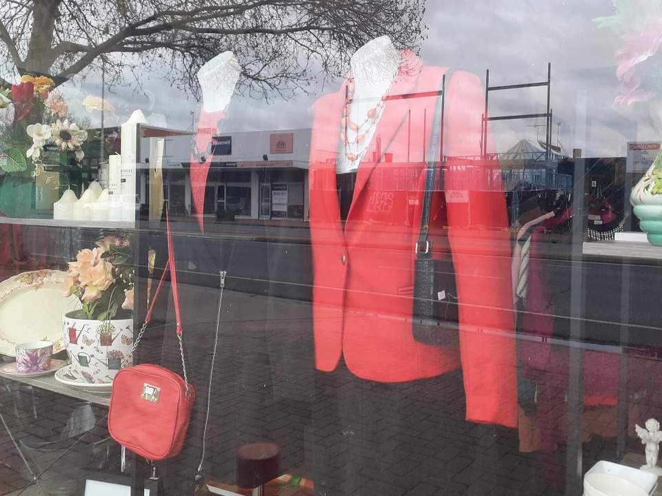 "Don't pass us by this week. We've plenty of specials inside!", said the window mannequins in unison.