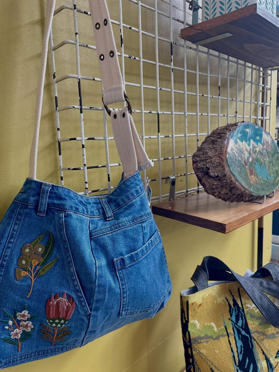 Here’s a selection of our lovely Spring collection- available on both our feature wall and cafe corner tomorrow! Lots of upcycled textiles, wool blanket off cuts turned into doorstops and bunting, donated crocheted circles reimagined in various gorgeous ways… handmade tapestries and stitcheries as well as lovely spring items that will bring a freshness to your home after the winter cold! Why not usher in the new season with something special from The Mustard Tree🌼🌸🧡