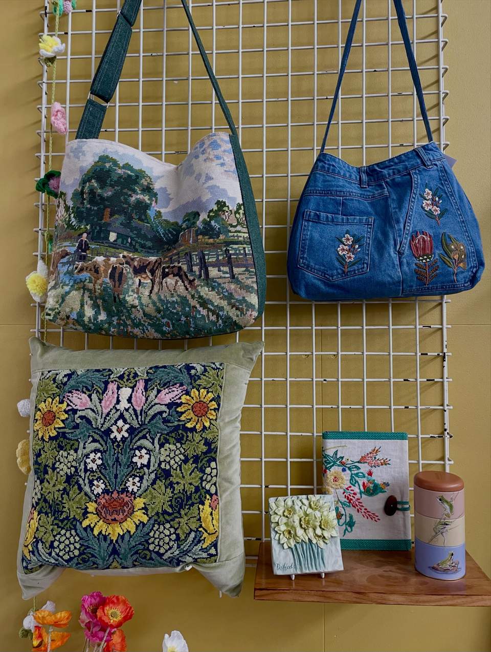 Here’s a selection of our lovely Spring collection- available on both our feature wall and cafe corner tomorrow! Lots of upcycled textiles, wool blanket off cuts turned into doorstops and bunting, donated crocheted circles reimagined in various gorgeous ways… handmade tapestries and stitcheries as well as lovely spring items that will bring a freshness to your home after the winter cold! Why not usher in the new season with something special from The Mustard Tree🌼🌸🧡