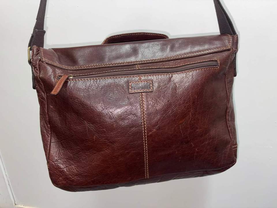 Good-quality unisex leather Aviator satchel in excellent condition, approximately 39 × 28 cm, offered in store for $115.