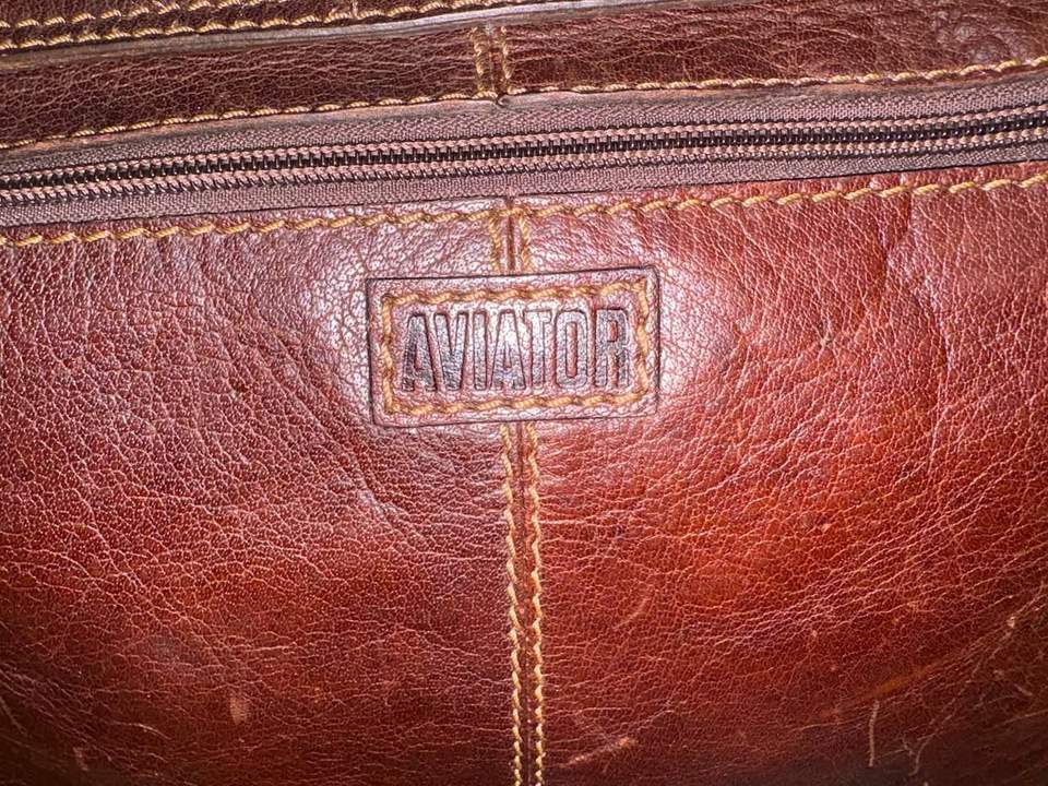 Good-quality unisex leather Aviator satchel in excellent condition, approximately 39 × 28 cm, offered in store for $115.