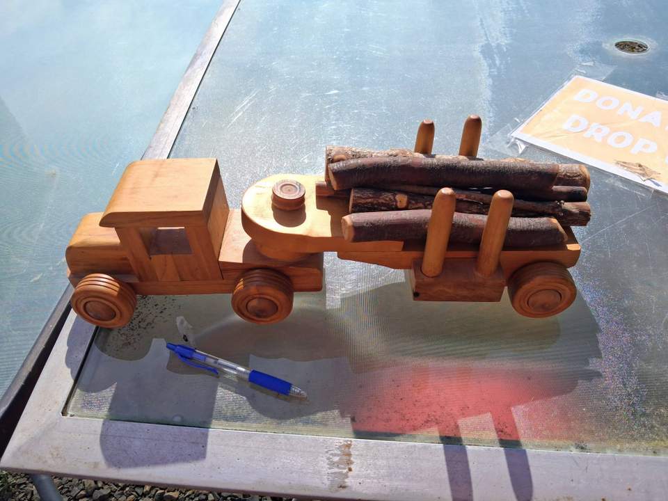 OneCoast auction #32: Wooden toy truck and trailer Auction closes: 8pm, Sunday 13 September Opening bid: $10 Just one small auction this week, a cute wooden logging truck with a trailer and half a load of logs that can easily be added to. Biro in the photos shows you the size.