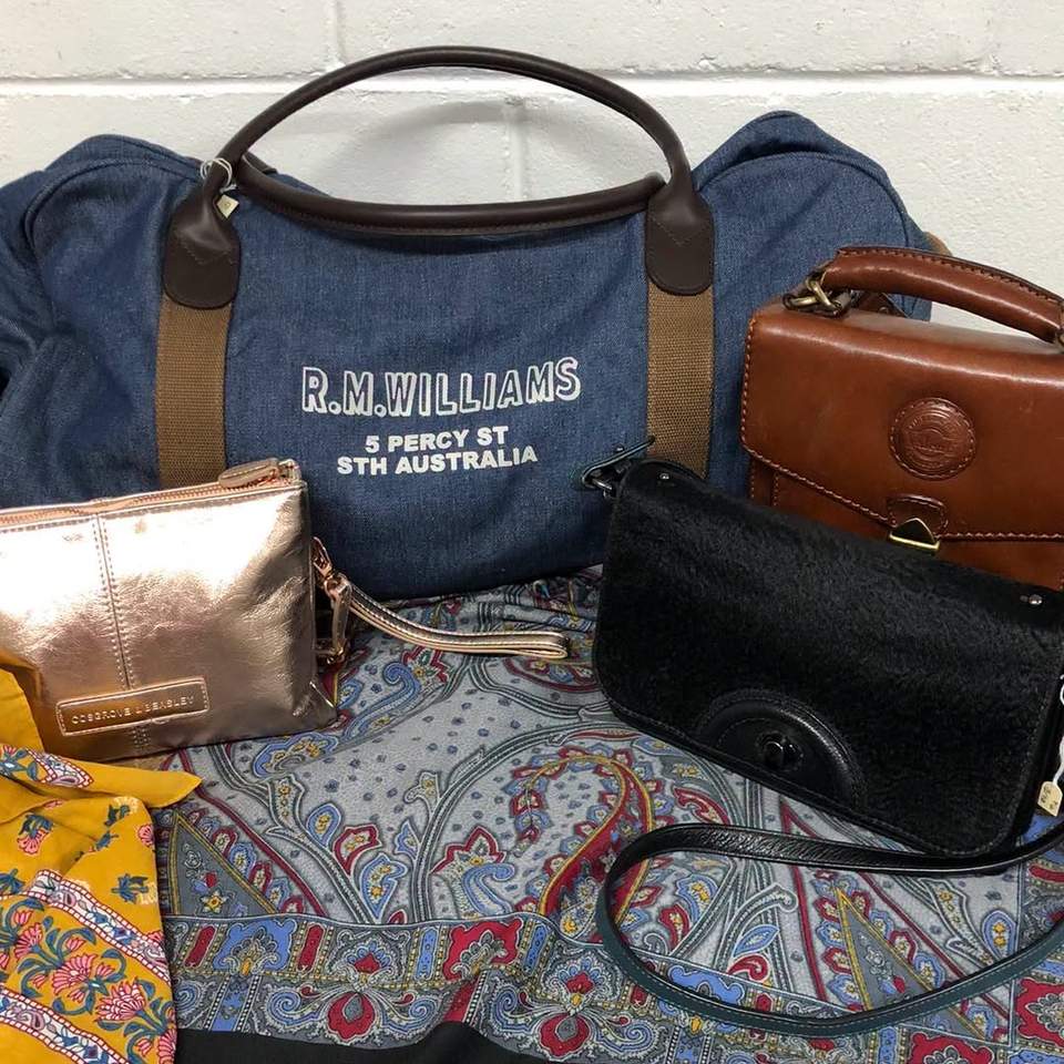 Bags in all shapes and sizes, including a black Mimco bag, and a RM Williams duffle bag. Red Geranium is at 486 Goodwood rd Cumberland Park SA