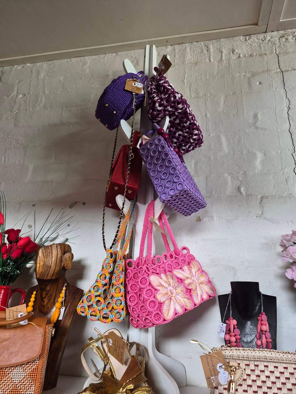New handbags in store. Great for the races or other special occasions! Priced betwern  $55-$75.