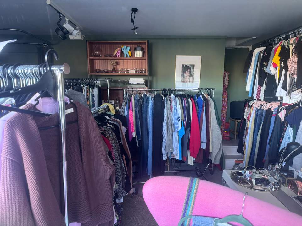 Little store with a few racks, limited hours.